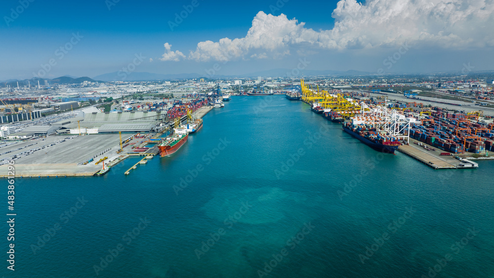 Fototapeta premium crane loading cargo container to container maritime ship in the international terminal container depot yard port concept freight shipping by ship at sunrise, webinar banner