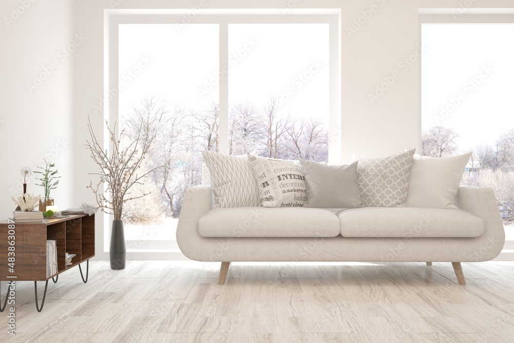 Fototapeta premium White living room with sofa and winter landscape in window. Scandinavian interior design. 3D illustration
