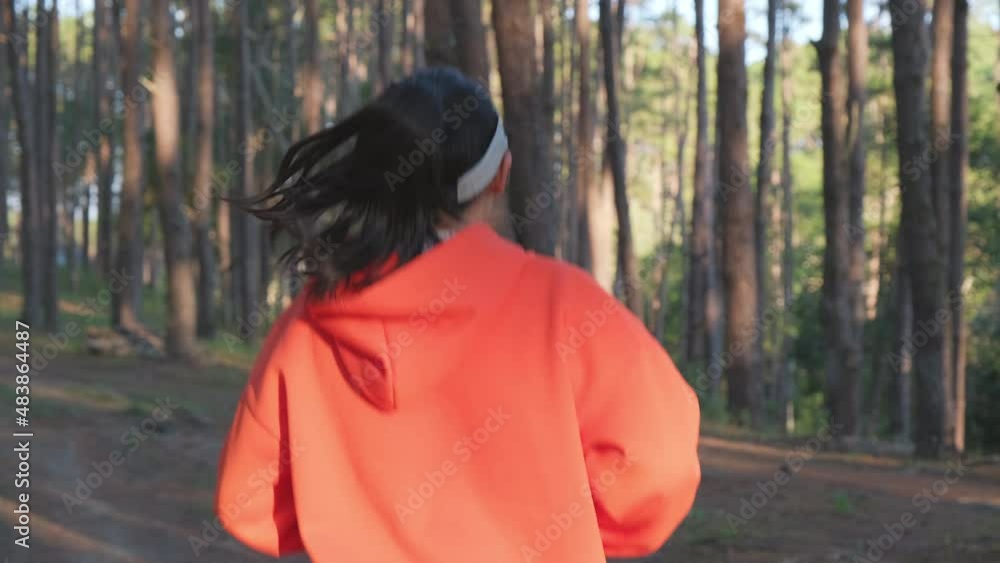 Athletic woman running on forest trail. Female runners running in nature in the morning. Workout Healthy lifestyle concept. Athletic woman running on forest trail. Female runners running in nature in the morning. Workout Healthy lifestyle concept.
