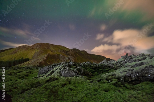 Fototapeta Naklejka Na Ścianę i Meble -  Ancient Lava fields in Iceland beside Þorbjörn mountain and the Blue Lagoon at night.