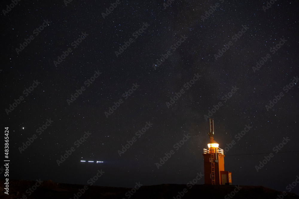 Hopsnes Lighthouse and the milky way,south coast of Iceland.Near the town of Grindavik. Hopsnes Lighthouse and the milky way,south coast of Iceland.Near the town of Grindavik.