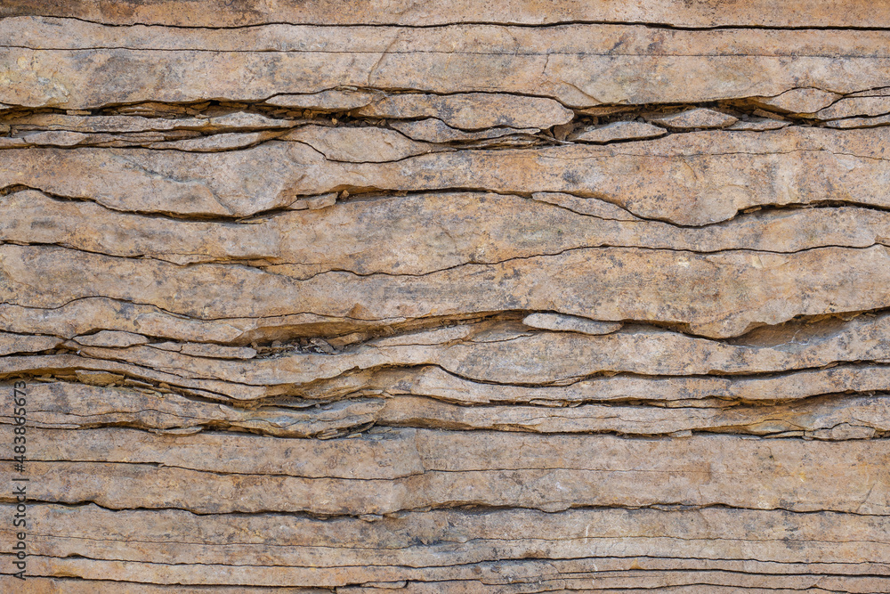 Natural stone wall, flagstone. Geological section of sedimentary rocks. Background for wallpaper, texture. Natural stone wall, flagstone. Geological section of sedimentary rocks. Background for wallpaper, texture.