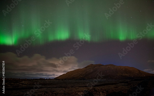 Aurora Borealis above lava fields in Iceland © Joe