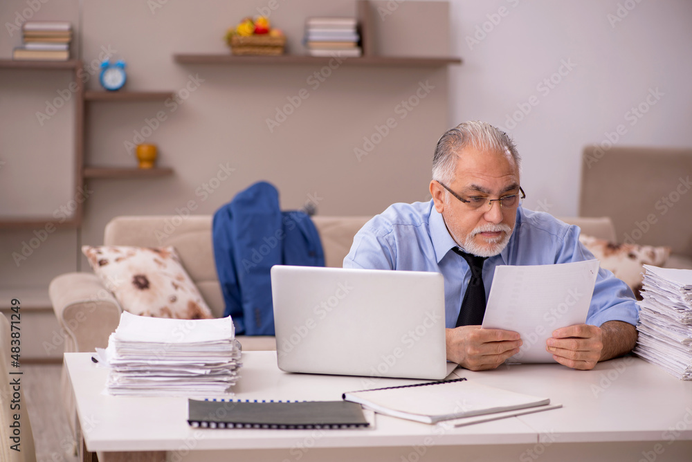 Old male boss working from home during pandemic Old male boss working from home during pandemic