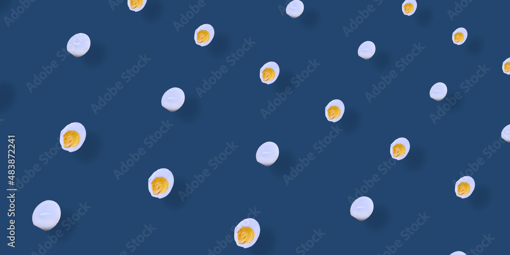 Colorful pattern of chicken eggs on blue background. Top view. Flat lay. Pop art design