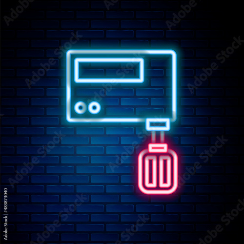 Glowing neon line Electric mixer icon isolated on brick wall background. Kitchen blender. Colorful outline concept. Vector