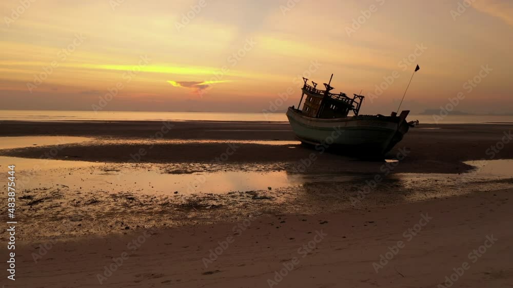 Sunset drone flight scene of boat wreck along shore side - Nathon harbour - Koh Samu Island in Thailand Sunset drone flight scene of boat wreck along shore side - Nathon harbour - Koh Samu Island in Thailand