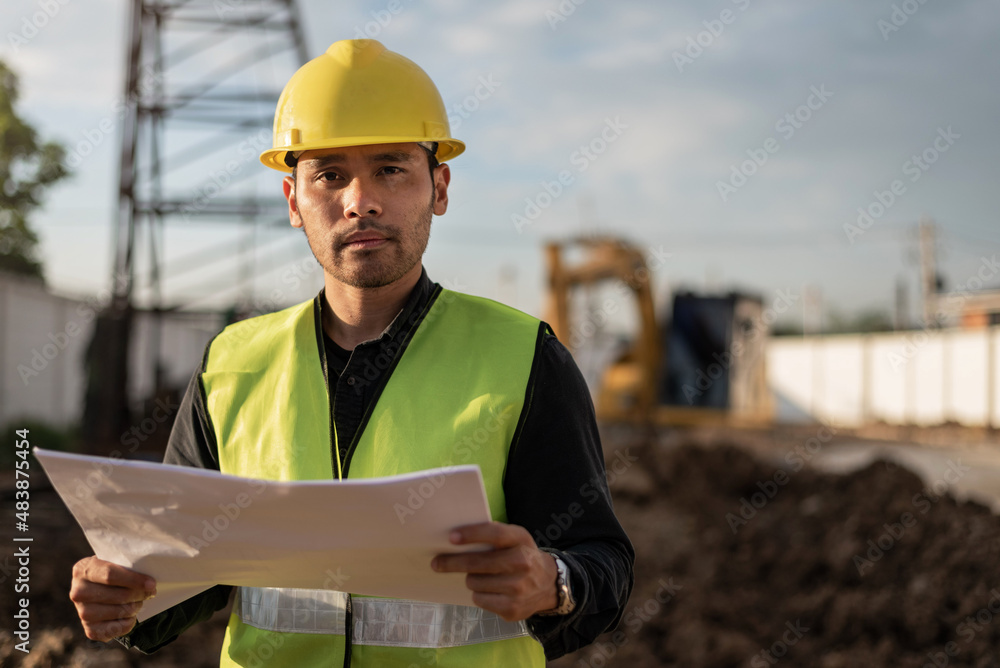 Engineer man working in building site. Young Worker man working in construction site. Engineering and Construction concept. Engineer man working in building site. Young Worker man working in construction site. Engineering and Construction concept.