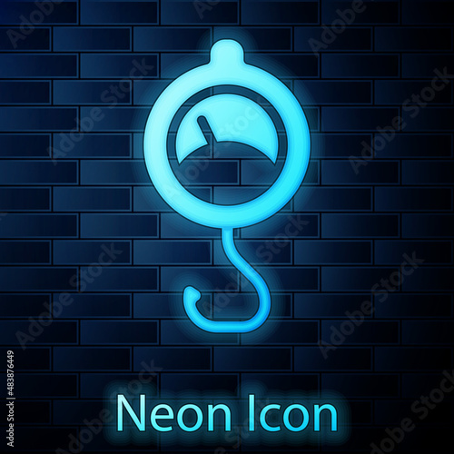 Glowing neon Spring scale icon isolated on brick wall background. Balance for weighing. Determination of weight. Vector