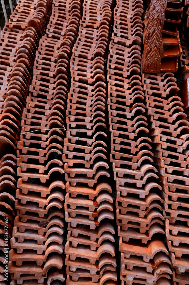 Stack of Red roof tiles for a Buddhist Temple restoration at Thailand. Stack of Red roof tiles for a Buddhist Temple restoration at Thailand.