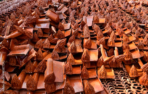 Stack of Red roof tiles for a Buddhist Temple restoration at Thailand.