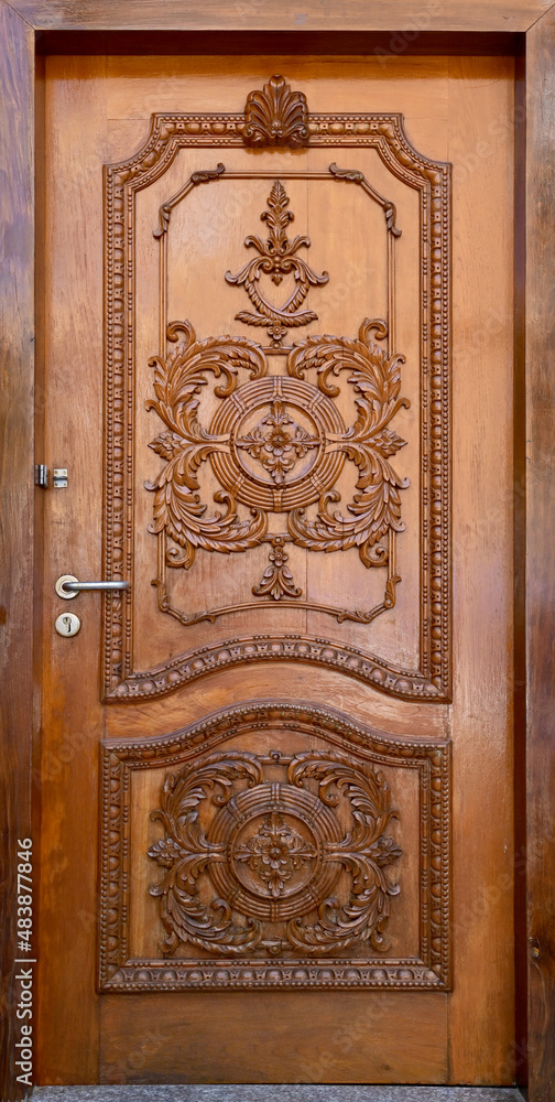 Golden Wood craft Thai classic pattern in door of Thai Temple at Thailand.