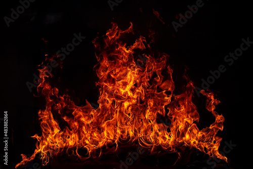 Fire blaze flames on black background. Fire burn flame isolated, abstract texture. Flaming explosion effect with burning fire.