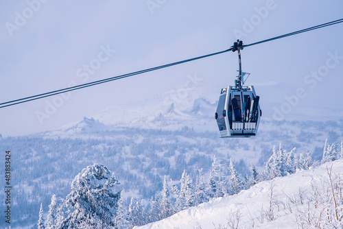 Landscape on mountain Sheregesh ski lift resort in winter sunset, aerial top view Kemerovo region Russia