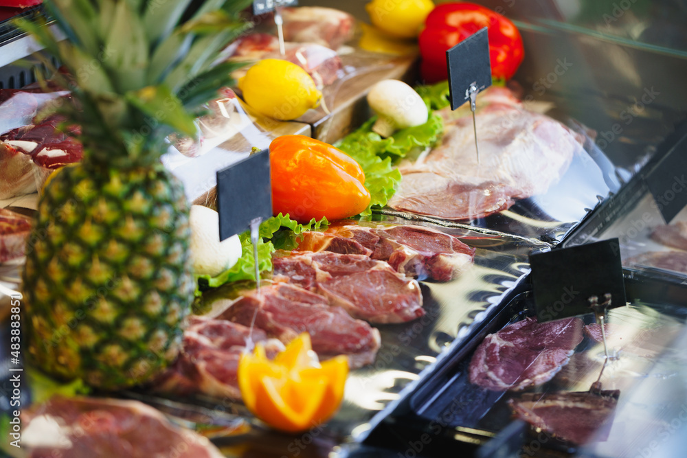 Fresh raw good quality meat on counter in Butcher shop Fresh raw good quality meat on counter in Butcher shop
