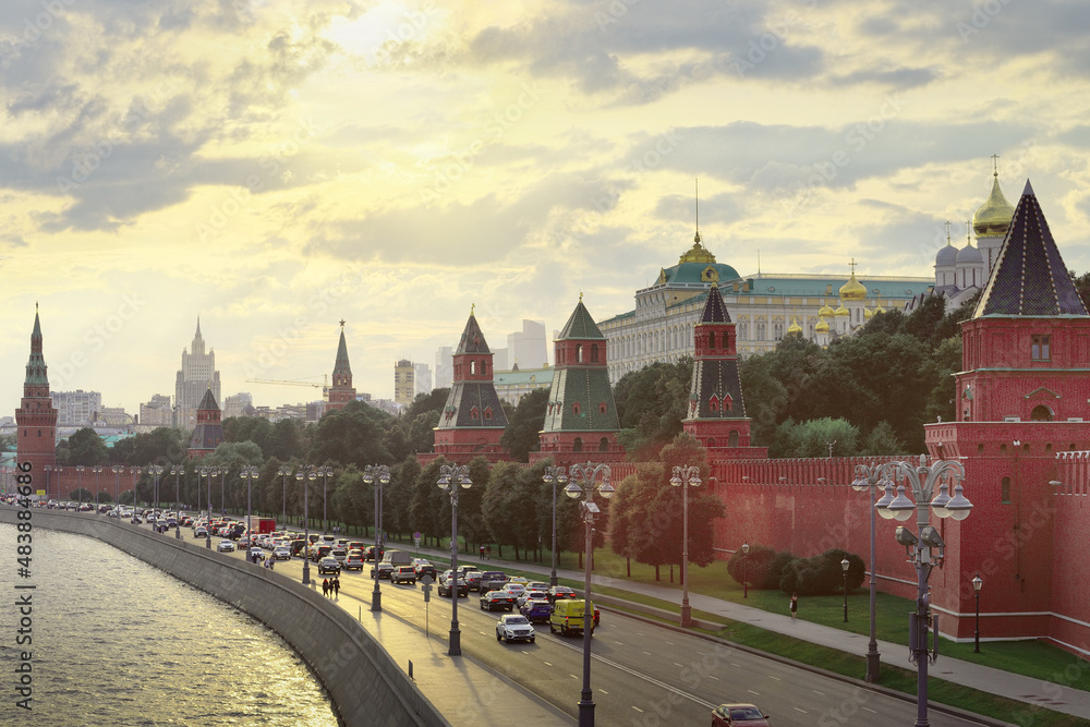 Kremlin embankment at sunset. Red brick towers and walls of the Moscow Kremlin