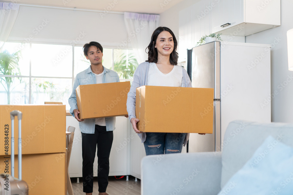 Asian young happy new marriage couple moving to new house together. Asian young happy new marriage couple moving to new house together.