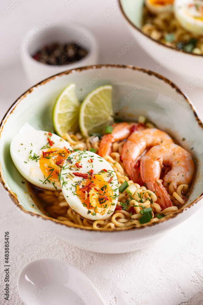 Bowl of ramen soup with shrimps and eggs