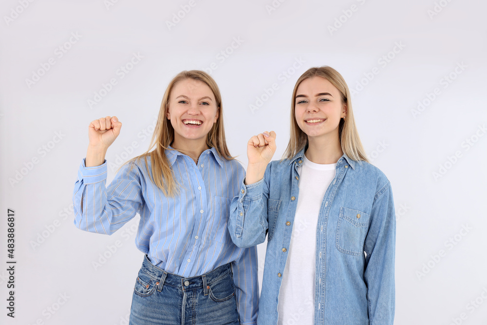 Obraz premium Girl power concept with two young women on white background