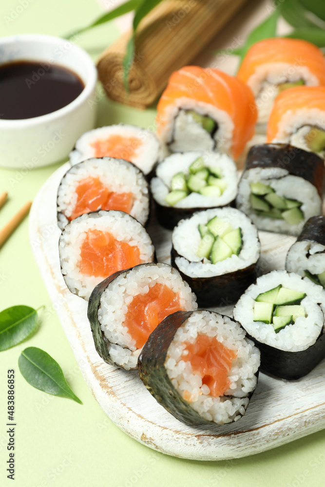 Concept of tasty food with sushi rolls, close up Concept of tasty food with sushi rolls, close up
