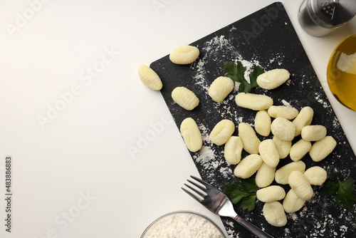 Concept of cooking potato gnocchi on white background