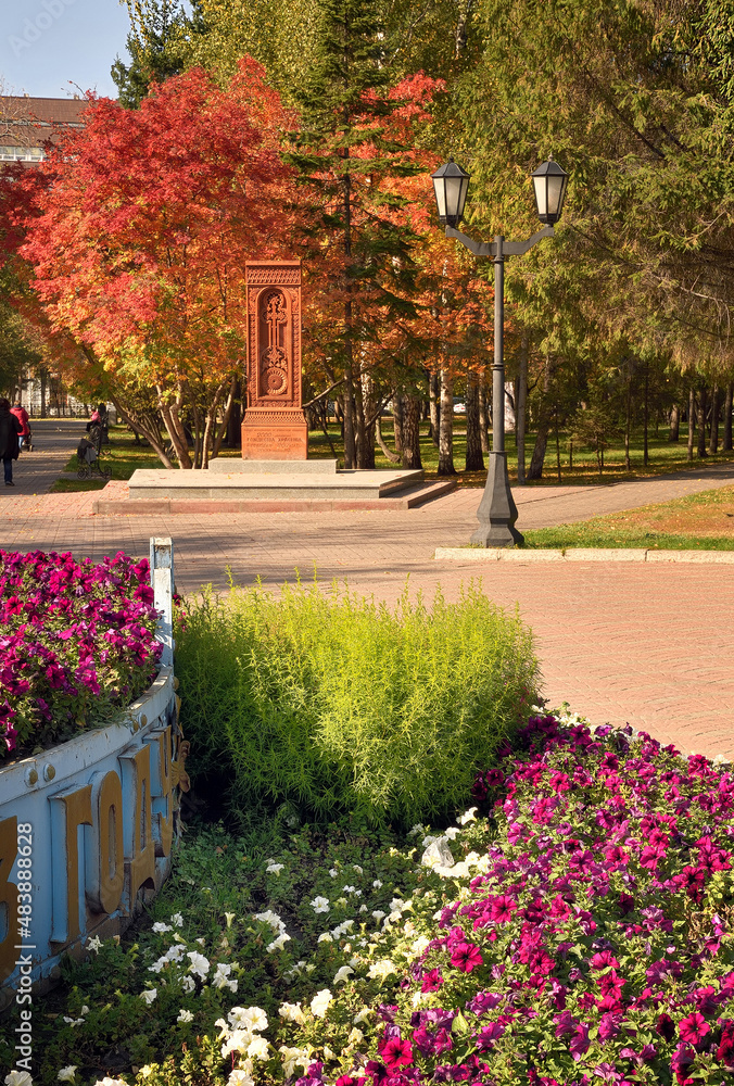 Autumn corner of Pervomaisky square. Bright flowers and autumn foliage