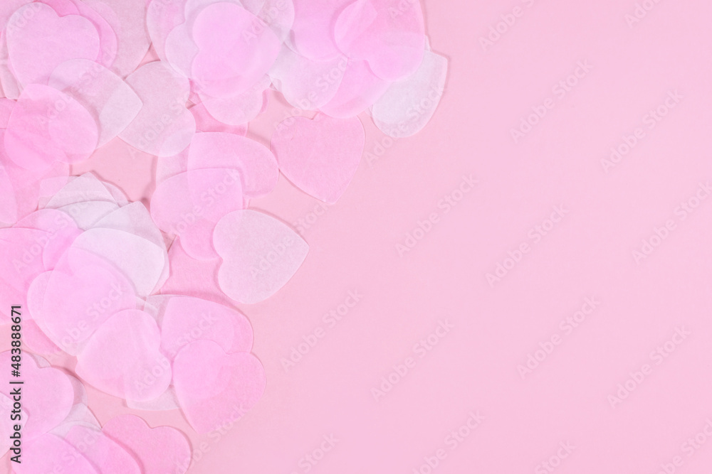 White and pink heart shaped paper confetti on pink background with copy space White and pink heart shaped paper confetti on pink background with copy space