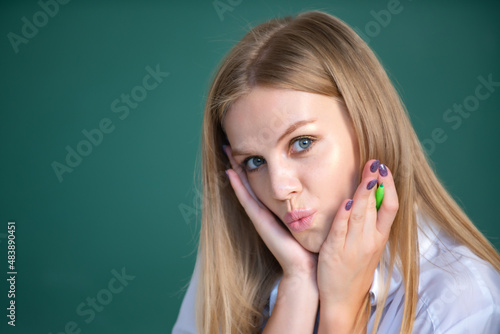 Portrait of cute attractive young woman student in university or high school college.