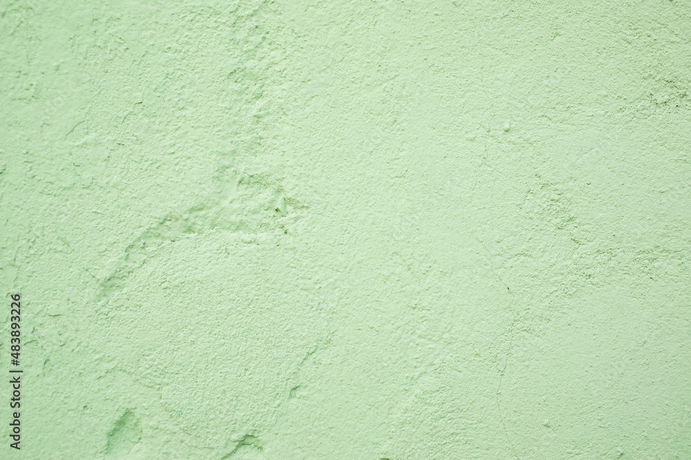 Obraz premium Green textured plastered wall, background, texture wallpaper.