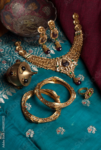 gold necklace on a blue background