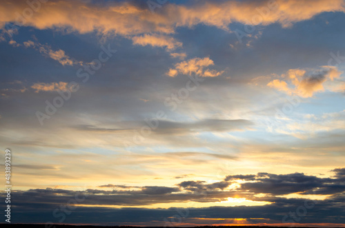 Beautiful sunset sky with amazing colorful clouds © Oksana