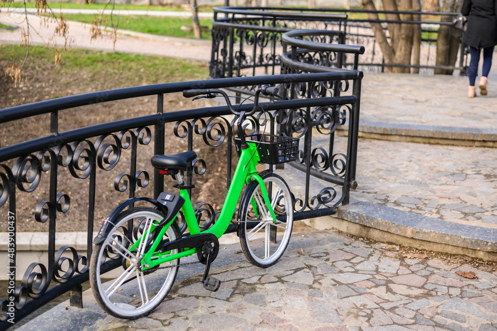 Bicycle secured on a parking in a city