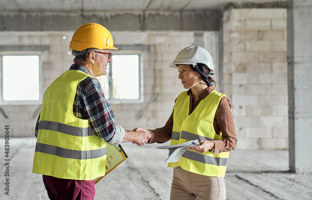 Caucasian engineer meet with architect on construction site Caucasian engineer meet with architect on construction site