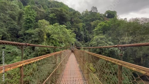 Trekking On Hanging Bridge To Rainbow Falls. Double Decker Living Root Bridge In The Dense Forest Of Meghalaya In India. POV photo