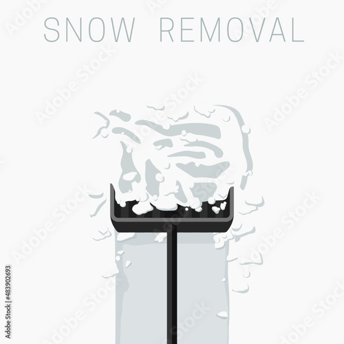 Snow removal with a shovel. Clearing garden paths after snowfall.