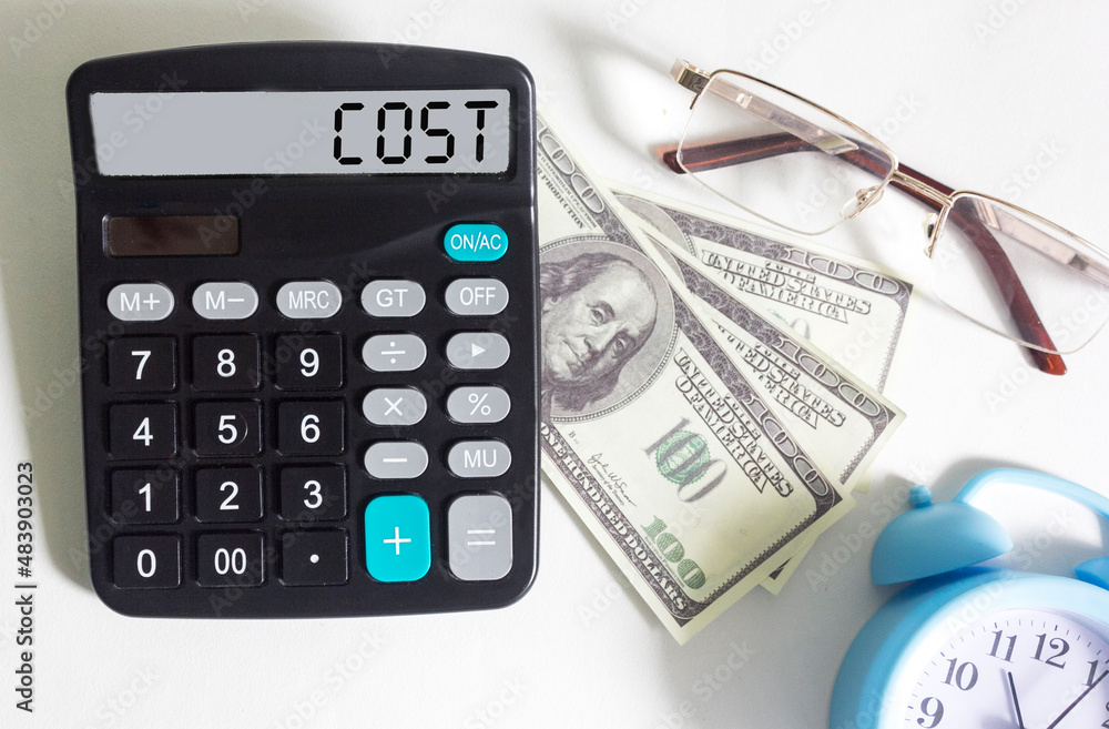 Calculator with the word cost on the display, next to dollars Calculator with the word cost on the display, next to dollars