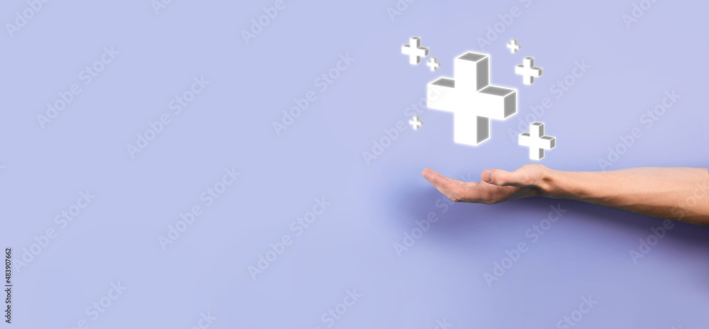 Businessman, man hold in hand offer positive thing such as profit, benefits, development, CSR represented by plus sign.The hand shows the plus sign Businessman, man hold in hand offer positive thing such as profit, benefits, development, CSR represented by plus sign.The hand shows the plus sign