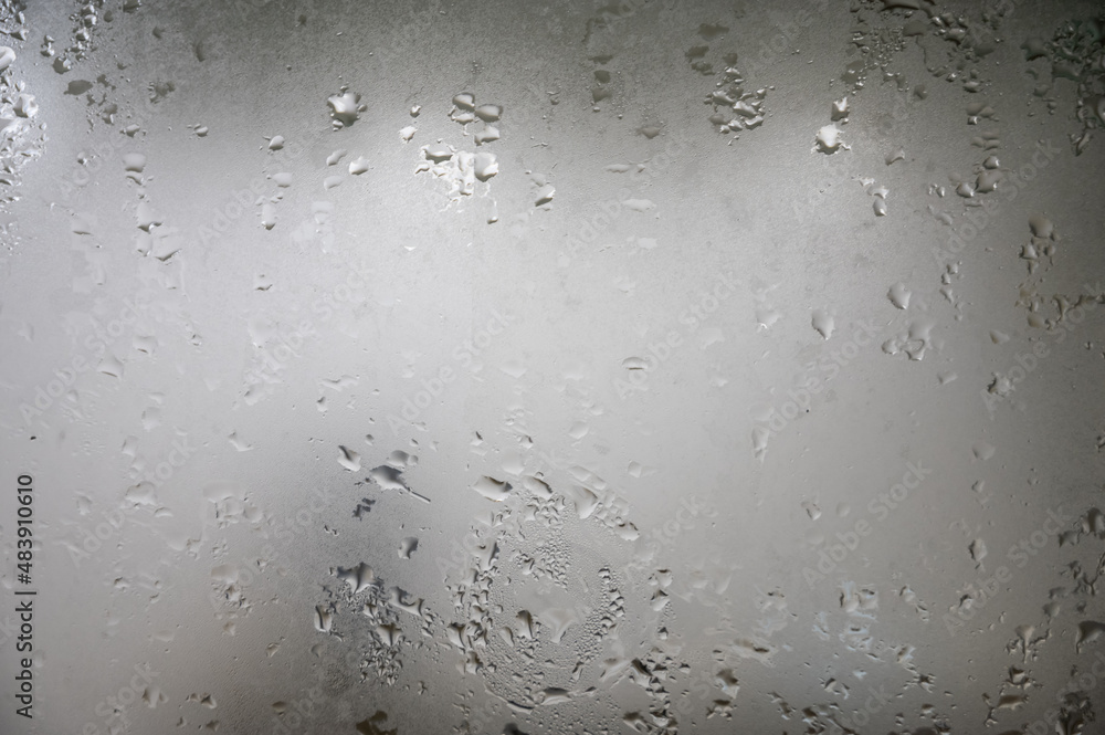 Wet misted glass with drops of water Wet misted glass with drops of water