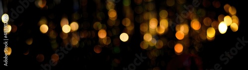 background banner bokeh of golden lights. defocusing