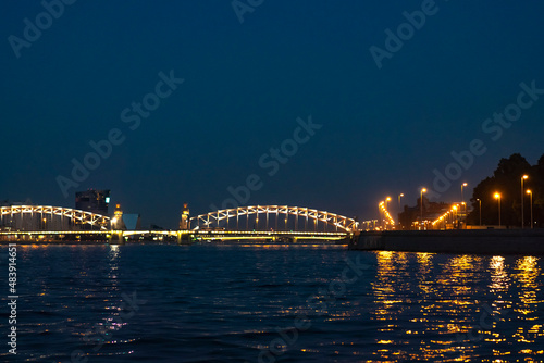 night view of illuminated Bolsheokhtinsky Bridge in Saint Petersburg, Russia © Yulia Raneva