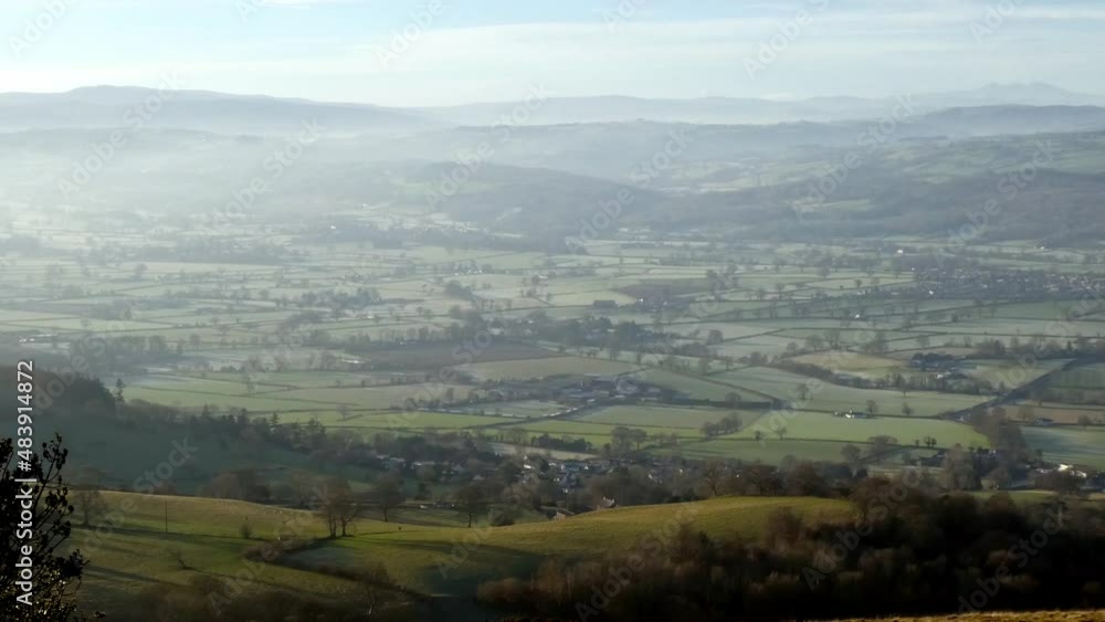 Distant misty layers of panoramic rural mountain valley countryside viewpoint at sunrise Distant misty layers of panoramic rural mountain valley countryside viewpoint at sunrise