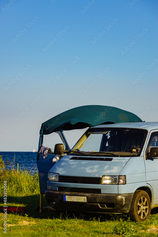 Camper van camping on sea shore