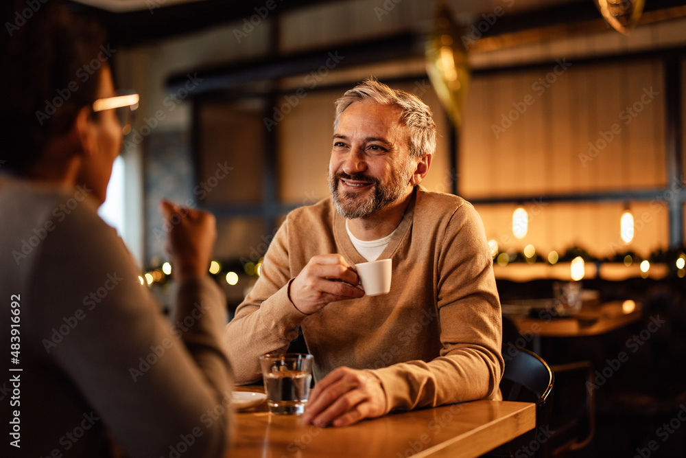Diverse couple, spending a lovely evening in a restaurant, for their anniversary.