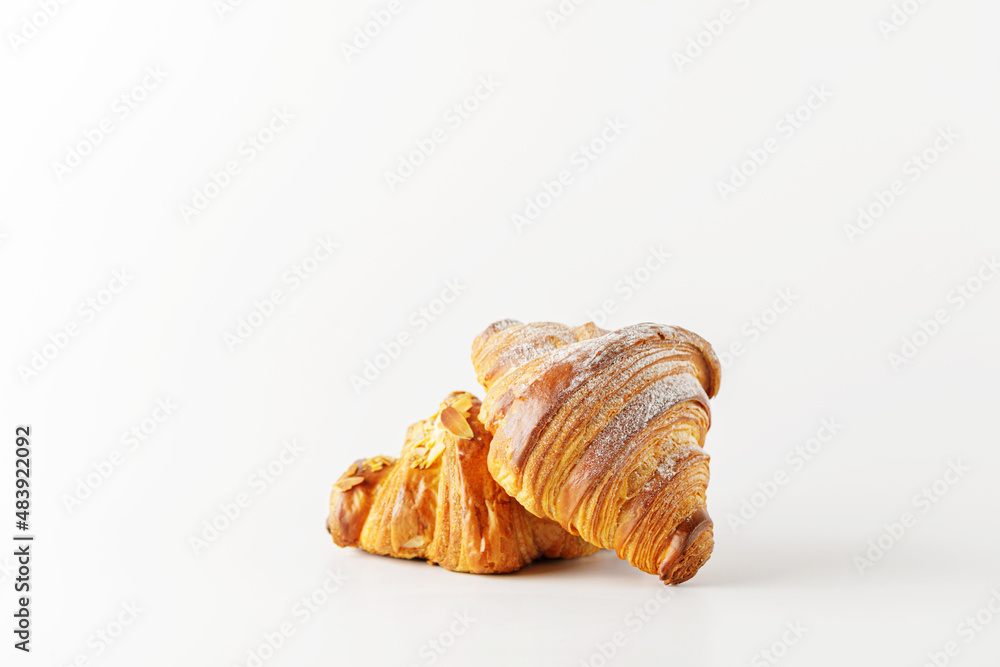 Delicious fresh croissants isolated on white background.