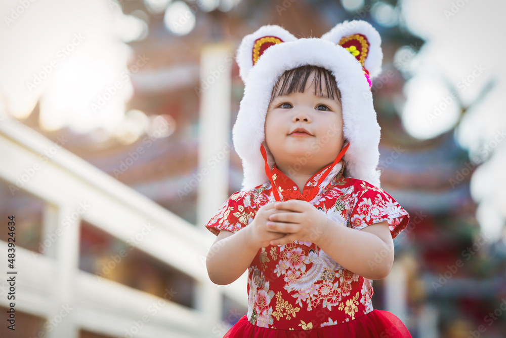 Asia Chinese baby girl in chinese tradition cloth stand in temple use