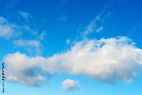 White clouds on a background of the sky with shades of blue