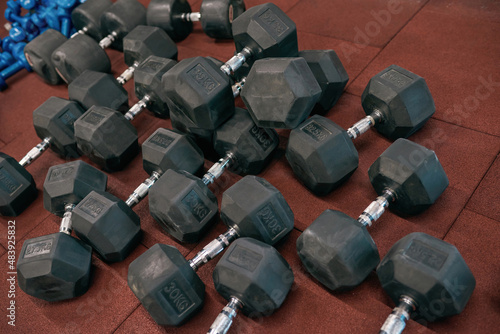 Collection of different weight dumbbells in gym