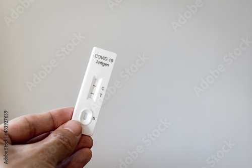 Covid 19 antigen rapid test kit with positive result for infection. Coronavirus rapid self-test home kit close-up image