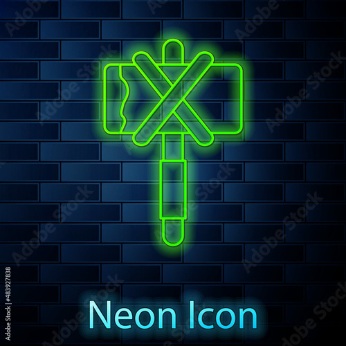 Glowing neon line Medieval axe icon isolated on brick wall background. Battle axe, executioner axe. Medieval weapon. Vector
