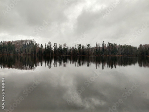 cloudy day over the lake with a beautiful reflection in the water